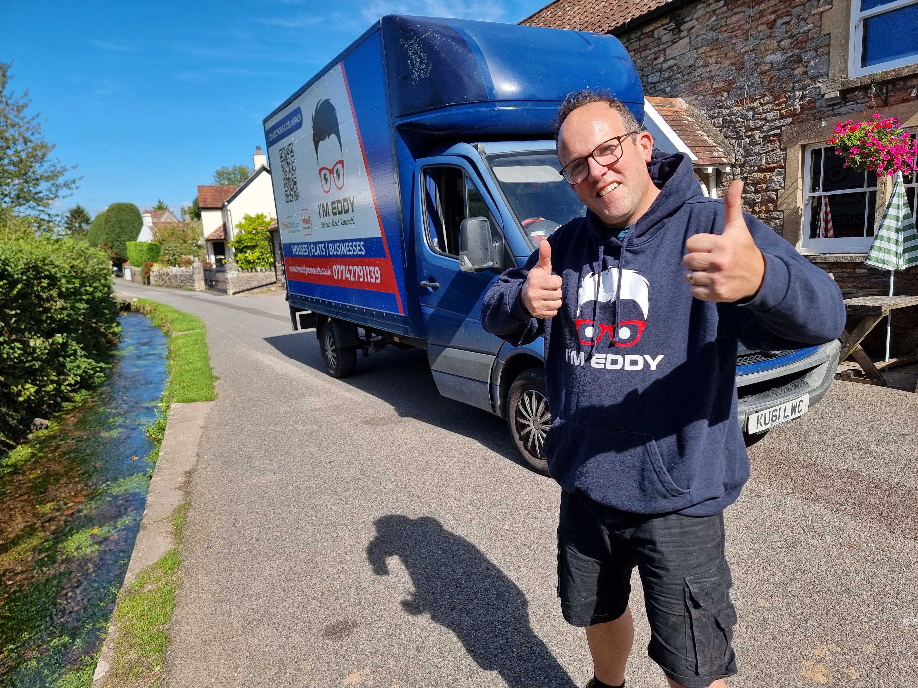 Eddy with his branded I'M EDDY removals van on a Somerset village lane